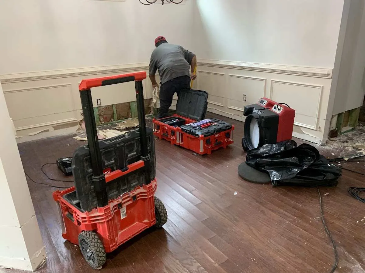 Technician setting up drying equipment for water damage in Freeport